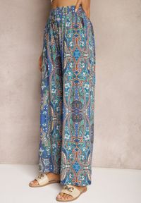 Renee - Niebieskie Kwiatowe Spodnie z Wiskozy High Waist z Szerokimi Nogawkami i Gumką w Pasie Kezorea. Stan: podwyższony. Kolor: niebieski. Materiał: wiskoza. Wzór: kwiaty. Styl: elegancki #4