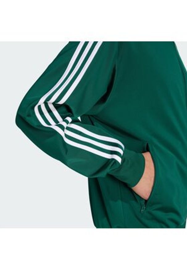 Adidas - adidas Bluza Firebird KD8314 Zielony Loose Fit. Kolor: zielony. Materiał: syntetyk