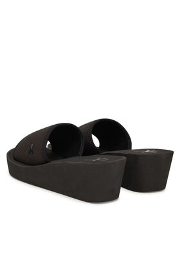 Calvin Klein Jeans Klapki Beach Wedge Slide Canvas YW0YW01725 Czarny. Kolor: czarny. Materiał: materiał