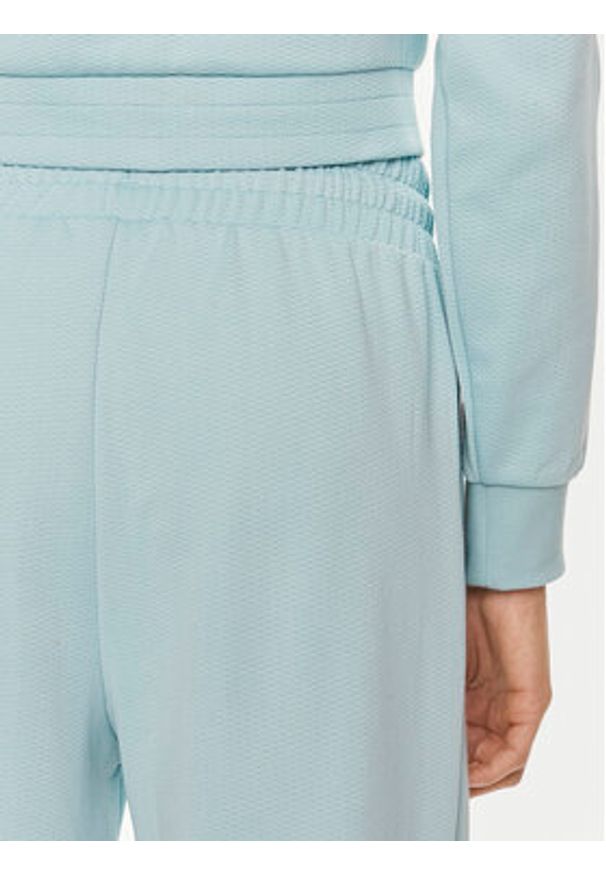 Puma Spodnie dresowe T7 624212 Niebieski Relaxed Fit. Kolor: niebieski. Materiał: syntetyk, bawełna