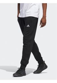 Adidas - adidas Spodnie dresowe Essentials HZ2218 Czarny Regular Fit. Kolor: czarny. Materiał: bawełna #1