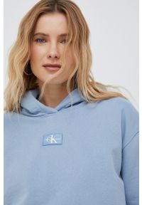Calvin Klein Jeans bluza bawełniana damska kolor fioletowy z kapturem z aplikacją. Typ kołnierza: kaptur. Kolor: fioletowy. Materiał: bawełna. Wzór: aplikacja