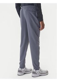 Under Armour Spodnie dresowe Unstoppable 6003861 Szary Loose Fit. Kolor: szary. Materiał: syntetyk