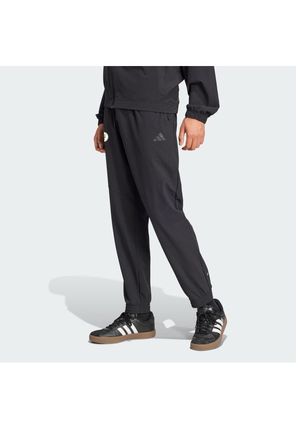 Adidas - Spodnie dresowe Algeria. Kolor: czarny. Materiał: dresówka. Sport: piłka nożna