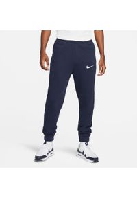 Spodnie treningowe męskie Nike FLC Park20. Kolor: niebieski, biały, wielokolorowy. Materiał: bawełna, dresówka