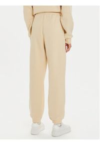 TOMMY HILFIGER - Tommy Hilfiger Spodnie dresowe Varsity WW0WW42884 Beżowy Regular Fit. Kolor: beżowy. Materiał: syntetyk, bawełna #2