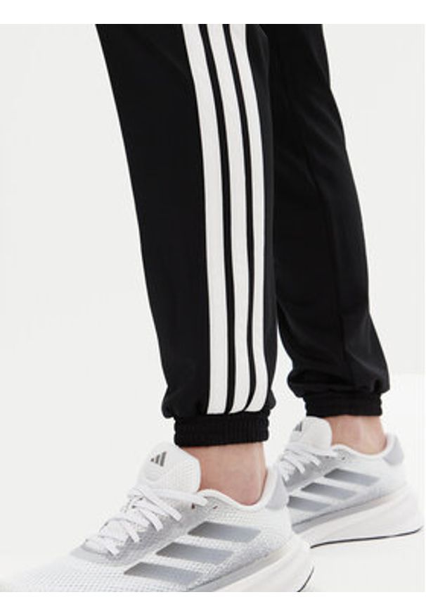Adidas - adidas Spodnie dresowe Tricot 3-Stripes JF3383 Czarny Regular Fit. Kolor: czarny. Materiał: syntetyk