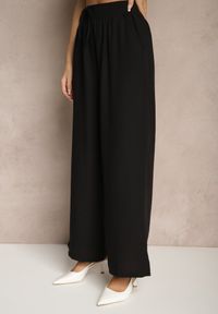 Renee - Czarne Szerokie Spodnie Palazzo High Waist z Ozdobnym Wiązaniem Arandiel. Okazja: na co dzień. Stan: podwyższony. Kolor: czarny. Materiał: jedwab. Styl: wizytowy, casual, street