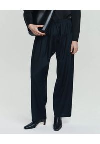 ANIA KUCZYŃSKA - Czarne wełniane spodnie Lana. Kolor: czarny. Materiał: wełna. Długość: długie. Styl: sportowy, elegancki