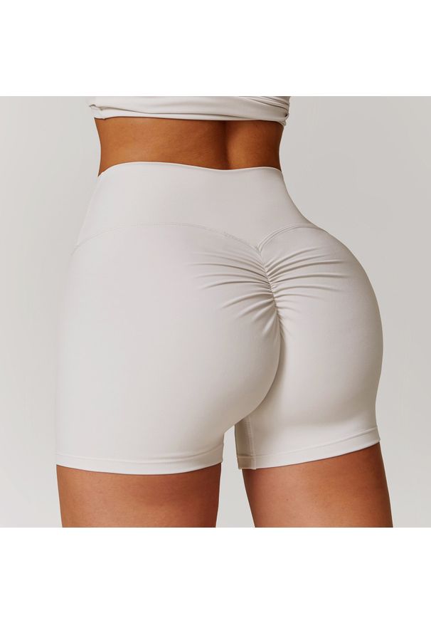 Intica - Spodenki sportowe modelujące z elastycznym pasem do treningu i biegania Essence. Kolor: biały. Materiał: materiał. Sport: fitness