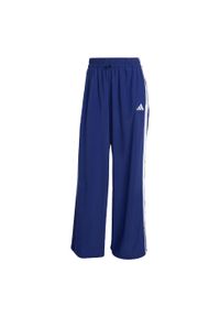 Adidas - Spodnie Essentials 3-Stripes Lifestyle Woven Parachute. Kolor: biały, wielokolorowy, niebieski. Materiał: materiał