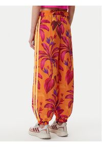 Adidas - adidas Spodnie dresowe FARM Premium JD6301 Pomarańczowy Loose Fit. Kolor: pomarańczowy. Materiał: syntetyk #5