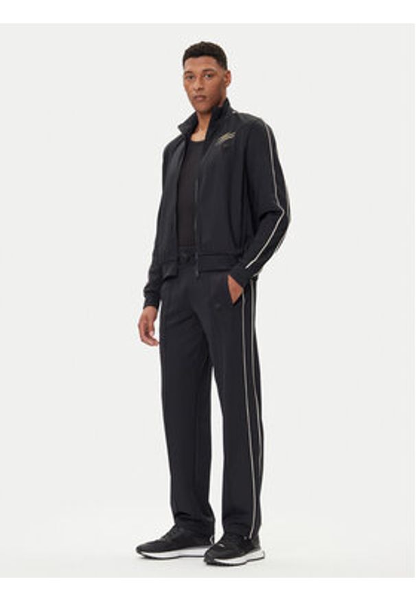 Plein Sport Spodnie dresowe FAEC MJT2680 STE003N Czarny Loose Fit. Kolor: czarny. Materiał: syntetyk