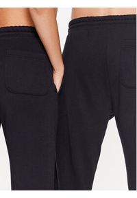 Converse Spodnie dresowe Unisex 10023873-A01 Czarny Standard Fit. Kolor: czarny. Materiał: bawełna