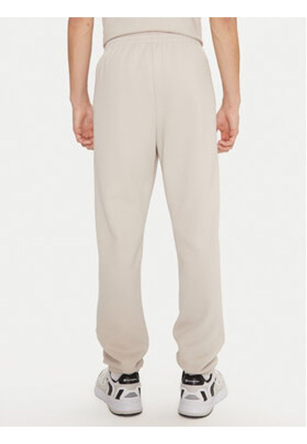 Champion Spodnie dresowe 220424 Écru Regular Fit. Materiał: syntetyk