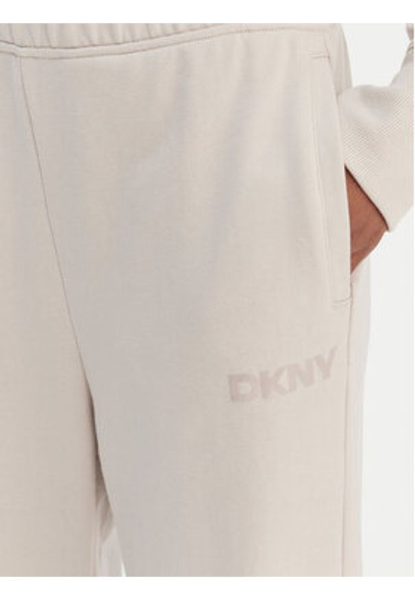 DKNY Sport Spodnie dresowe DP6P3795 Beżowy Regular Fit. Kolor: beżowy. Materiał: bawełna