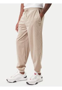 Guess Spodnie dresowe Z6RB14 KD612 Beżowy Regular Fit. Kolor: beżowy. Materiał: syntetyk #1