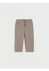 Reserved - Dresowe spodnie z przeszyciami - brązowy. Kolor: brązowy. Materiał: dresówka