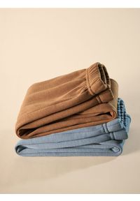 Reserved - Spodnie z ociepleniem - brązowy. Kolor: brązowy. Materiał: bawełna, dzianina