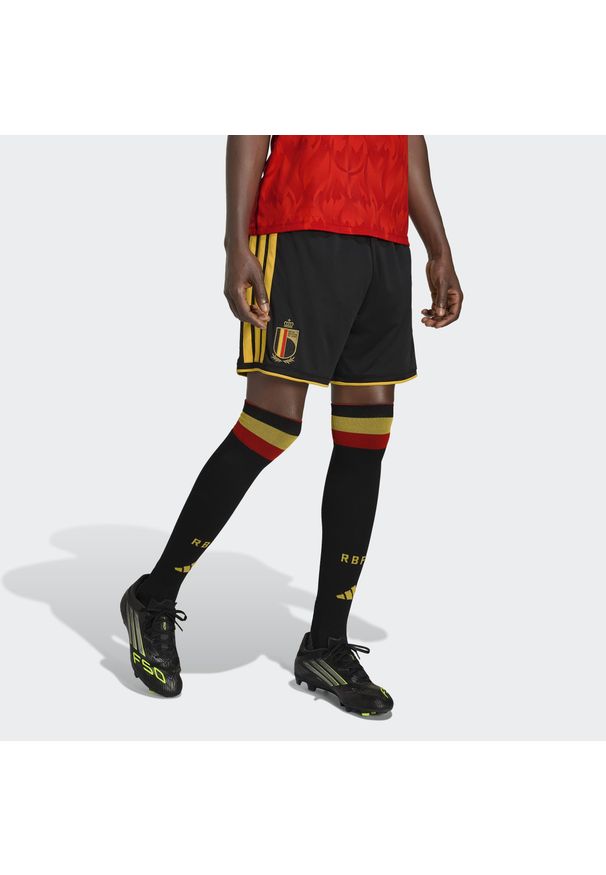 Adidas - Szorty Belgium 26 Home Replica Shorts. Kolor: żółty, czarny, wielokolorowy. Sport: piłka nożna
