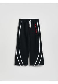 Reserved - Spodnie z lampasem - czarny. Kolor: czarny. Materiał: dzianina, wiskoza #1