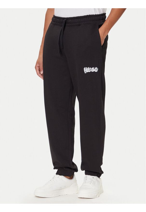 Hugo - HUGO Spodnie dresowe Nyrotro 50549779 Czarny Loose Fit. Kolor: czarny. Materiał: bawełna
