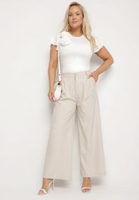 Born2be - Jasnobeżowe Szerokie Spodnie z Wysokim Stanem Dolalissa. Okazja: na co dzień. Stan: podwyższony. Kolor: beżowy. Styl: elegancki, casual