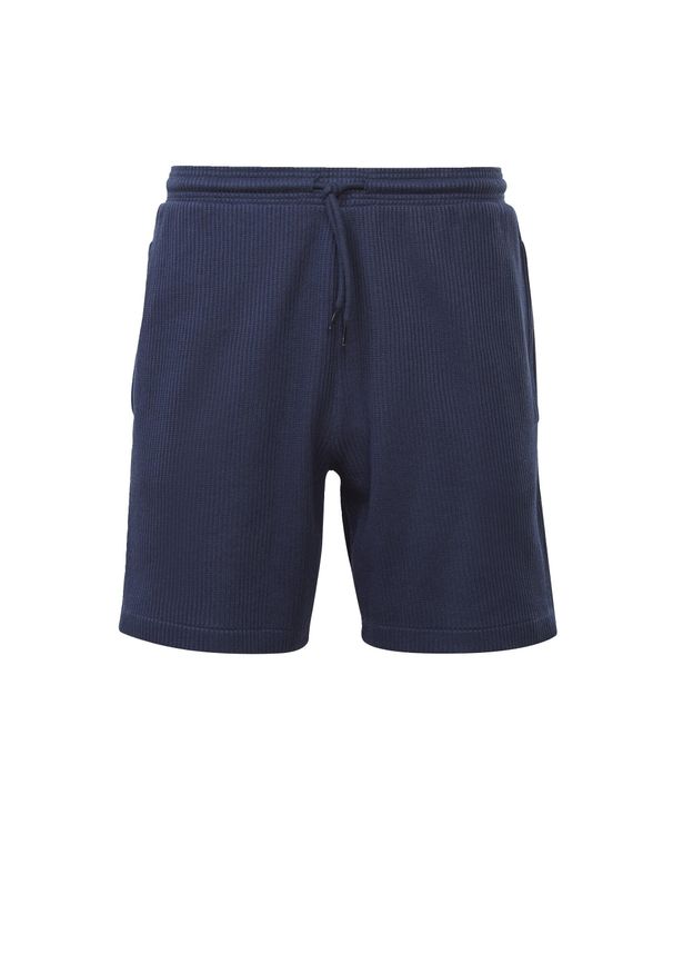 Krótkie spodenki Reebok z niebieskiej bawełny. Kolor: niebieski. Materiał: bawełna. Długość: krótkie