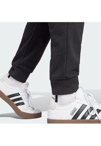 Adidas - adidas Spodnie dresowe Essentials Feel Cozy JE3854 Czarny Regular Fit. Kolor: czarny. Materiał: bawełna #5