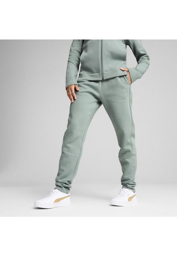 Puma - Damskie spodnie dresowe EVOSTRIPE PUMA Green Moon. Kolor: zielony. Materiał: dresówka. Sport: turystyka piesza