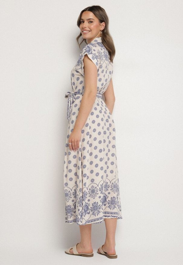 Born2be - Beżowo-Niebieska Koszulowa Sukienka z Wiskozy w Kwiatowy Wzór z Wiązanym Paskiem Iffinara. Okazja: na co dzień, na randkę, na spacer. Kolor: niebieski. Materiał: wiskoza. Długość rękawa: krótki rękaw. Wzór: kwiaty. Typ sukienki: koszulowe. Styl: klasyczny, casual, elegancki