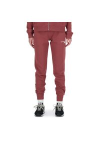 Spodnie dresowe New Balance WP03805WAD - różowe. Kolor: różowy. Materiał: dresówka