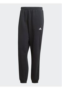 Adidas - adidas Spodnie dresowe HY1288 Czarny Loose Fit. Kolor: czarny. Materiał: dresówka, bawełna #6