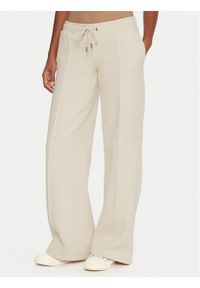 Guess Jeans Spodnie dresowe W5BB04 KC811 Beżowy Wide Leg. Kolor: beżowy. Materiał: bawełna