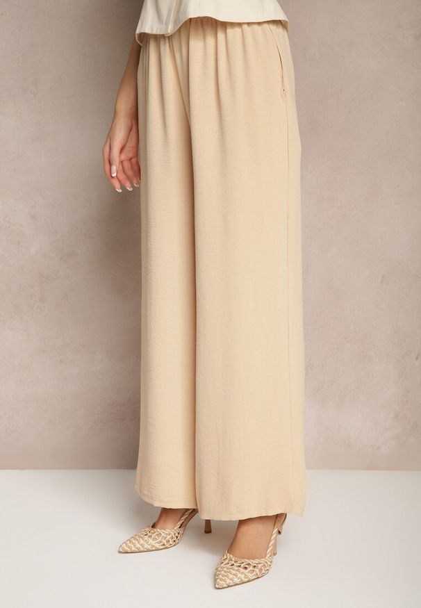 Renee - Beżowe Szerokie Spodnie Typu Palazzo High Waist Araneira. Okazja: na co dzień, na spotkanie biznesowe, na spacer. Stan: podwyższony. Kolor: beżowy. Styl: casual, elegancki, biznesowy