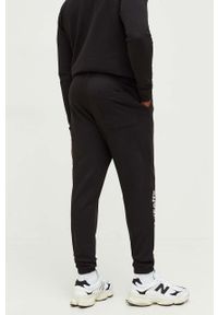 Tommy Jeans spodnie dresowe bawełniane kolor czarny z nadrukiem. Kolor: czarny. Materiał: bawełna, dresówka. Wzór: nadruk #6