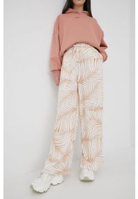 Roxy spodnie damskie kolor beżowy szerokie high waist. Stan: podwyższony. Kolor: beżowy. Materiał: tkanina