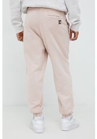 Karl Kani spodnie dresowe bawełniane kolor różowy gładkie. Stan: podwyższony. Kolor: różowy. Materiał: bawełna, dresówka. Wzór: gładki #5