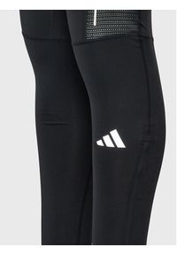 Adidas - adidas Legginsy Own the Run Leggings HM8444 Czarny Fitted Fit. Kolor: czarny. Materiał: syntetyk. Sport: bieganie