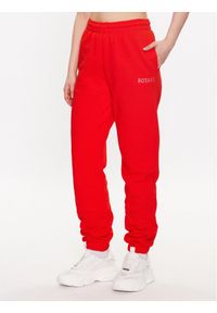 ROTATE Spodnie dresowe Mimi 7001571030 Czerwony Relaxed Fit. Kolor: czerwony. Materiał: bawełna