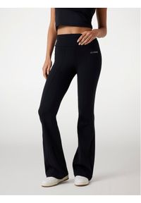 Guess Spodnie materiałowe 175791 Czarny Slim Fit. Kolor: czarny. Materiał: materiał