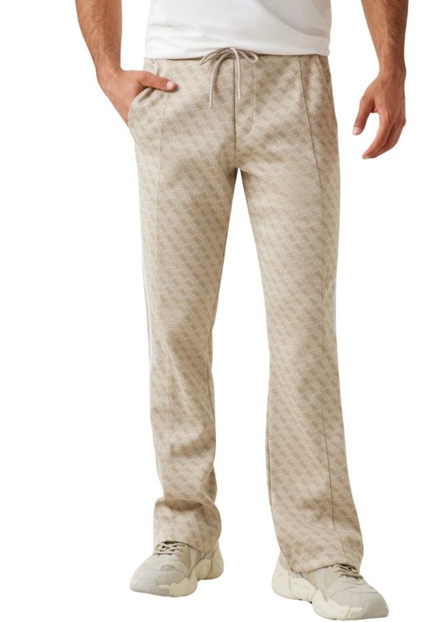 Guess - GUESS Beżowe męskie spodnie dresowe z lampasami w zielony monogram Parimo 4G, Rozmiar XXL. Kolor: beżowy. Materiał: dresówka