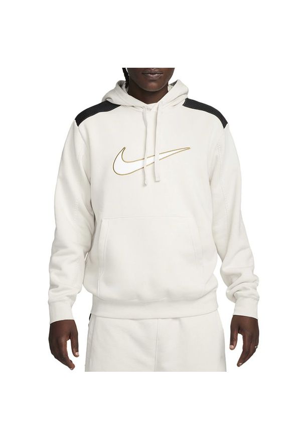 Bluza Nike Sportswear FLC FN0247-104 - beżowa. Typ kołnierza: kaptur. Kolor: beżowy. Materiał: materiał, bawełna, poliester. Wzór: aplikacja. Styl: klasyczny