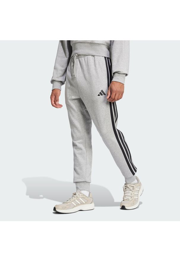 Adidas - Spodnie Essential 3-Stripes French Terry. Kolor: czarny, szary, wielokolorowy. Materiał: materiał. Sport: fitness