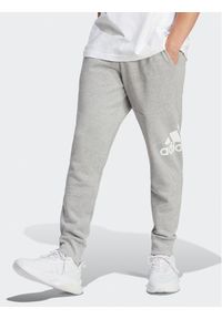 Adidas - adidas Spodnie dresowe Essentials HA4345 Szary Regular Fit. Kolor: szary. Materiał: bawełna