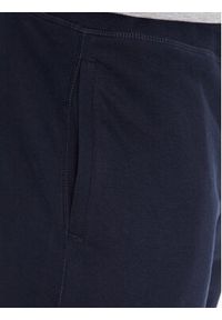 TOMMY HILFIGER - Tommy Hilfiger Spodnie dresowe UM0UM02880 Granatowy Regular Fit. Kolor: niebieski. Materiał: bawełna