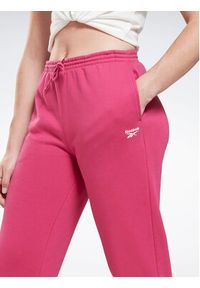 Reebok Spodnie dresowe Identity H54768 Różowy Regular Fit. Kolor: różowy. Materiał: dresówka, bawełna