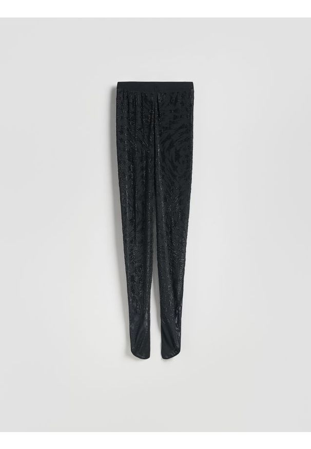 Reserved - Legginsy z ozdobną aplikacją - czarny. Kolor: czarny. Materiał: dzianina. Wzór: aplikacja