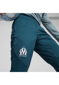 Spodnie piłkarskie Puma Olympique de Marseille 24/25 treningowe. Materiał: materiał. Sport: piłka nożna