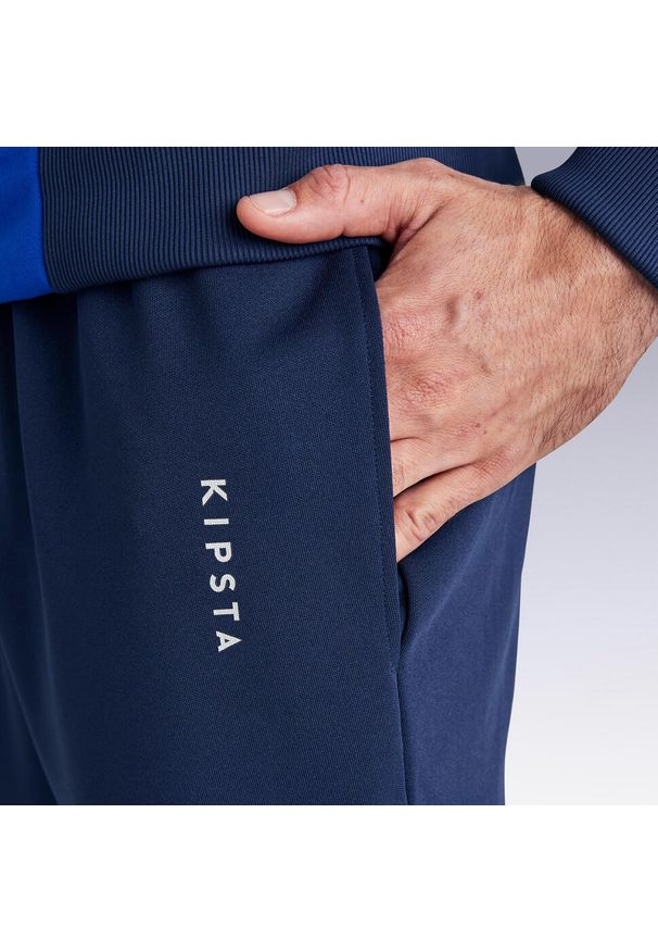 KIPSTA - Spodnie piłkarskie Kipsta Essential. Kolor: niebieski. Materiał: poliester, materiał. Sport: piłka nożna